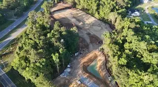 Aerial view of land clearing and rough grading along a Lowcountry roadway