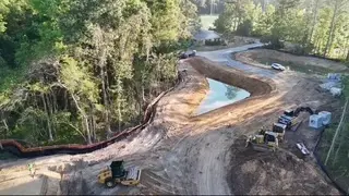 Aerial view of a detention pond and shaped site on an Earthco Construction project